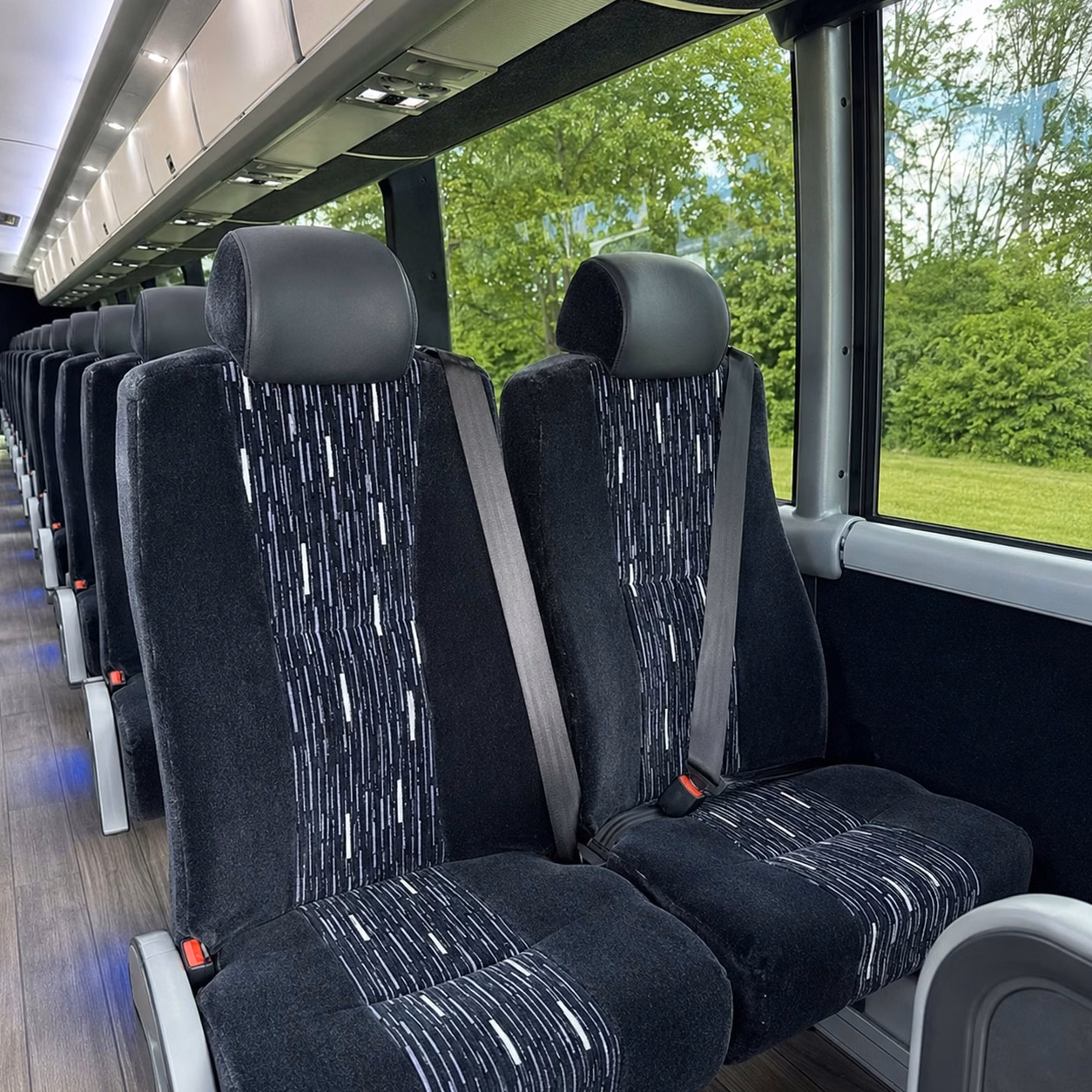 how the time of year and peak seasons affect charter bus rental prices in detroit